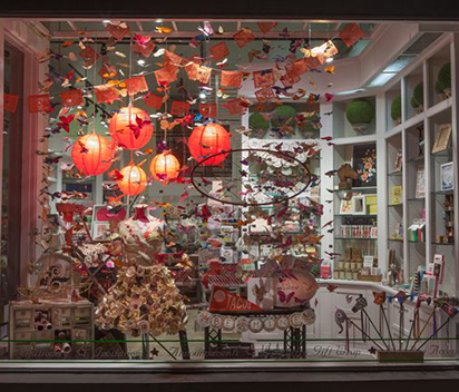 Holiday Window Displays with Metallic Crepe